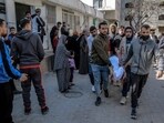 Palestinians carry away the body of a man killed in Israeli bombardment
