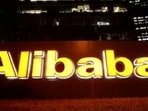 The Alibaba Group logo is lit up at its office building in Beijing, China.