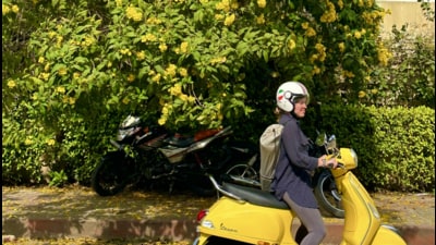 A woman drives past a tree with yellow flowers, likely to be the Caribbean Trumpet, which is believed to have been brought to Delhi in the 1970s. Its peak flowering shall arrive next month. (HT Photo) A woman drives past a tree with yellow flowers, likely to be the Caribbean Trumpet, which is believed to have been brought to Delhi in the 1970s. Its peak flowering shall arrive next month. (HT Photo)