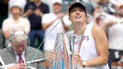 Iga Swiatek of Poland reacts as streamers are blasted off at the trophy ceremony after defeating Maria Sakkari of Greece during the Women's Final of the BNP Paribas Open at Indian Wells (Getty Images via AFP) Iga Swiatek of Poland reacts as streamers are blasted off at the trophy ceremony after defeating Maria Sakkari of Greece during the Women's Final of the BNP Paribas Open at Indian Wells (Getty Images via AFP)