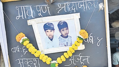 Mumbai, India - March 18, 2024: Mother Sonu manoj kavtiya, resident of Subhas Nagar, Wadala bridge, sits beside notice board, after her 2 sons, Ankush age 6 and Arjun age 4, died due to drowning in open water tank yesterday, at Maharshi Karve Udyan at Wadala, in Mumbai, India, on Monday, March 18, 2024. (Photo by Anshuman Poyrekar/ Hindustan Times) (Hindustan Times) Mumbai, India - March 18, 2024: Mother Sonu manoj kavtiya, resident of Subhas Nagar, Wadala bridge, sits beside notice board, after her 2 sons, Ankush age 6 and Arjun age 4, died due to drowning in open water tank yesterday, at Maharshi Karve Udyan at Wadala, in Mumbai, India, on Monday, March 18, 2024. (Photo by Anshuman Poyrekar/ Hindustan Times) (Hindustan Times)
