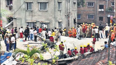 Nine people dead as a five-storey under construction building collapsed on the adjacent slum at Azhar Molla Bagan at Garden Reach in Kolkata on Monday. (HT Photo) Nine people dead as a five-storey under construction building collapsed on the adjacent slum at Azhar Molla Bagan at Garden Reach in Kolkata on Monday. (HT Photo)