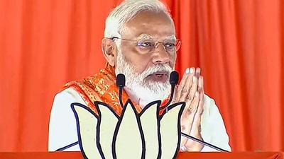 Prime Minister Narendra Modi joins hands while addressing the crowd in Telangana. (PTI) Prime Minister Narendra Modi joins hands while addressing the crowd in Telangana. (PTI)