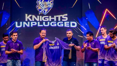 Kolkata Knight Riders mentor Gautam Gambhir and officials unveil a jersey. (PTI) Kolkata Knight Riders mentor Gautam Gambhir and officials unveil a jersey. (PTI)
