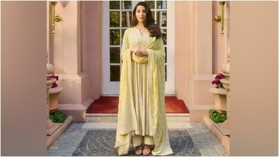 Nora accessorised the anarkali kurta and palazzo set with minimal yet striking gold and opal green stone jewellery, including jhumkis and a statement ring. She chose peep-toe mint green heels to style the ensemble. Lastly, side-parted loose locks styled in soft goddess waves gave the finishing touch. (Instagram) Nora accessorised the anarkali kurta and palazzo set with minimal yet striking gold and opal green stone jewellery, including jhumkis and a statement ring. She chose peep-toe mint green heels to style the ensemble. Lastly, side-parted loose locks styled in soft goddess waves gave the finishing touch. (Instagram)