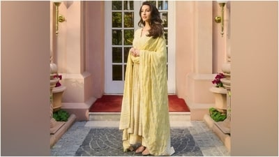 Nora paired the anarkali kurta with matching yellow-coloured palazzo pants featuring a scalloped design on the hem, a flared silhouette, and Chikankari and sequin embroidery on the broad patti on the border. Lastly, she carried a chiffon dupatta decked in matching Chikankari embroidery on the borders and sequinned leaf patterns adorned in the middle to complete the ethnic look. (Instagram) Nora paired the anarkali kurta with matching yellow-coloured palazzo pants featuring a scalloped design on the hem, a flared silhouette, and Chikankari and sequin embroidery on the broad patti on the border. Lastly, she carried a chiffon dupatta decked in matching Chikankari embroidery on the borders and sequinned leaf patterns adorned in the middle to complete the ethnic look. (Instagram)