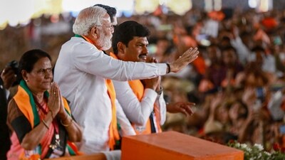Shivamogga: Prime Minister Narendra Modi waves at supporters during an election rally ahead of Lok Sabha polls, in Shivamogga, Monday, March 18, 2024. (PTI) Shivamogga: Prime Minister Narendra Modi waves at supporters during an election rally ahead of Lok Sabha polls, in Shivamogga, Monday, March 18, 2024. (PTI)