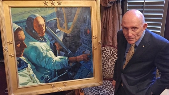 Retired NASA astronaut Tom Stafford, a native of Weatherford, Okla.,, who flew the first lunar module to the moon in 1969, stands in front of a portrait made in his honor (AP)