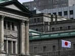 The Japanese flag flies over part of the Bank of Japan (BoJ) headquarters complex in central Tokyo. Japan's central bank was widely expected to scrap its maverick negative interest rate policy and hike borrowing costs. The Japanese flag flies over part of the Bank of Japan (BoJ) headquarters complex in central Tokyo. Japan's central bank was widely expected to scrap its maverick negative interest rate policy and hike borrowing costs.