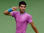Carlos Alcaraz of Spain gestures to the crowd while playing Daniil Medvedev of Russia during the Men's Final of the BNP Paribas Open at Indian Wells Tennis Garden Carlos Alcaraz of Spain gestures to the crowd while playing Daniil Medvedev of Russia during the Men's Final of the BNP Paribas Open at Indian Wells Tennis Garden