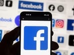 The Facebook logo is seen The Facebook logo is seen