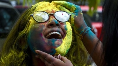 1. Oil your hair before playing with colours: Oiling your hair with coconut oil before playing with colours can create a protective barrier between your hair and the harsh chemicals present in the colours. It will also make your hair easier to clean post-celebrations.&nbsp; (utpal sarkar/ANI Photo)