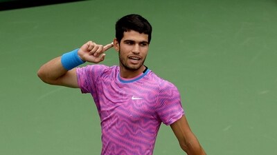 Carlos Alcaraz of Spain gestures to the crowd while playing Daniil Medvedev of Russia during the Men's Final of the BNP Paribas Open at Indian Wells Tennis Garden (Getty Images via AFP) Carlos Alcaraz of Spain gestures to the crowd while playing Daniil Medvedev of Russia during the Men's Final of the BNP Paribas Open at Indian Wells Tennis Garden (Getty Images via AFP)