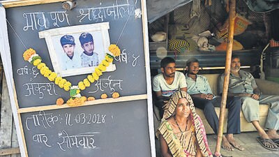 Mumbai, India - March 18, 2024: Mother Sonu manoj kavtiya, resident of Subhas Nagar, Wadala bridge, sits beside notice board, after her 2 sons, Ankush age 6 and Arjun age 4, died due to drowning in open water tank yesterday, at Maharshi Karve Udyan at Wadala, in Mumbai, India, on Monday, March 18, 2024. (Photo by Anshuman Poyrekar/ Hindustan Times) (Hindustan Times) Mumbai, India - March 18, 2024: Mother Sonu manoj kavtiya, resident of Subhas Nagar, Wadala bridge, sits beside notice board, after her 2 sons, Ankush age 6 and Arjun age 4, died due to drowning in open water tank yesterday, at Maharshi Karve Udyan at Wadala, in Mumbai, India, on Monday, March 18, 2024. (Photo by Anshuman Poyrekar/ Hindustan Times) (Hindustan Times)
