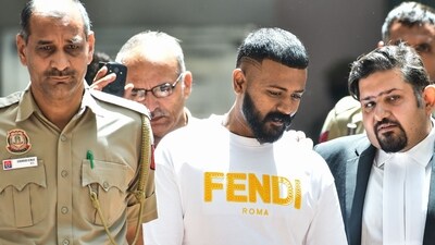 Conman Sukesh Chandrashekhar leaves after being produced at Patiala House court in connection with a money laundering case, in New Delhi earlier. (PTI) Conman Sukesh Chandrashekhar leaves after being produced at Patiala House court in connection with a money laundering case, in New Delhi earlier. (PTI)