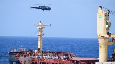 Pirates detained by the Indian navy during a rescue operation for the hijacked ship MV Ruen sit on the deck in this handout image released on March 16, 2024. (via Reuters)
