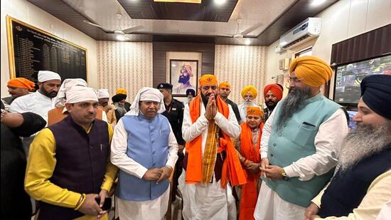 Haryana chief minister Nayab Singh Saini (centre) flanked by Speaker Gian Chand Gupta and Ambala BJP Lok Sabha candidate Banto Kataria after paying obeisance at Nada Sahib Gurdwara in Panchkula on Tuesday. (Sant Arora/HT)