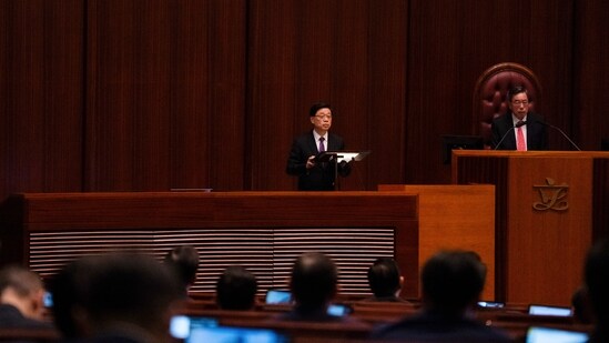 Hong Kong's Chief Executive John Lee, center, speaks to lawmakers following the passing of the Basic Law Article 23 legislation (AP)