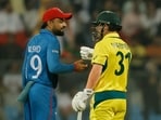 Afghanistan's Rashid Khan and Australia's David Warner during the World Cup match