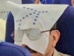 The Indigo passenger wore a pair of spectacles over the headrest cover. The Indigo passenger wore a pair of spectacles over the headrest cover.