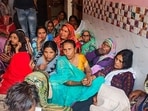 Family members and relatives mourn after two boys were killed by a local barber on Tuesday, in Badaun on Wednesday. Family members and relatives mourn after two boys were killed by a local barber on Tuesday, in Badaun on Wednesday.