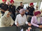 Sidhu Moosewala’s father Balkaur Singh (Middle) and mother Charan Kaur. Sidhu Moosewala’s father Balkaur Singh (Middle) and mother Charan Kaur.