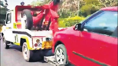 A screengrab shows the car being towed while two people were seated inside. (HT) A screengrab shows the car being towed while two people were seated inside. (HT)