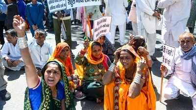 New Delhi, Mar 15 (ANI): Refugees from Pakistan and Afghanistan hold placards as they stage a protest against Congress over their remarks on the implementation of the CAA, outside the AICC headquarters in New Delhi on Friday. (ANI Photo/Amit Sharma) (Amit Sharma) New Delhi, Mar 15 (ANI): Refugees from Pakistan and Afghanistan hold placards as they stage a protest against Congress over their remarks on the implementation of the CAA, outside the AICC headquarters in New Delhi on Friday. (ANI Photo/Amit Sharma) (Amit Sharma)