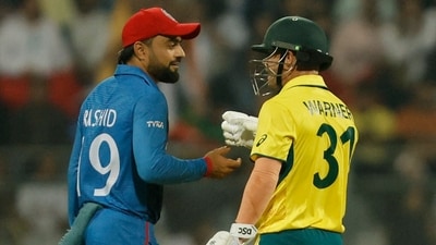 Afghanistan's Rashid Khan and Australia's David Warner during the World Cup match (REUTERS)