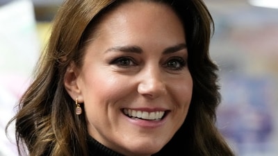 Kate, Princess of Wales smiles as she speaks to a woman during her visit to Sebby's Corner in north London on Nov. 24, 2023. (AP)