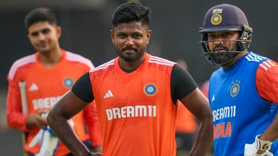 Sanju Samson (c) with India's captain Rohit Sharma (R) during a practice session (PTI) Sanju Samson (c) with India's captain Rohit Sharma (R) during a practice session (PTI)