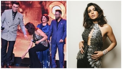 Karan Johar reacts as Samantha Ruth Prabhu tries to touch his feet at an event. Karan Johar reacts as Samantha Ruth Prabhu tries to touch his feet at an event.