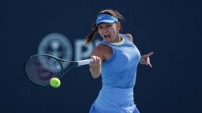 Simona Halep of Romania returns a shot to Paula Badosa of Spain during her women's singles match during the Miami Open (Getty Images via AFP) Simona Halep of Romania returns a shot to Paula Badosa of Spain during her women's singles match during the Miami Open (Getty Images via AFP)