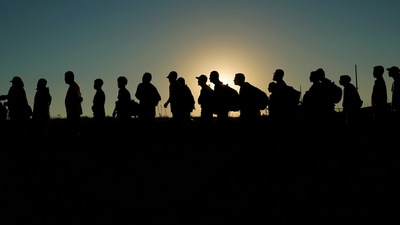 FILE - Migrants who crossed the Rio Grande and entered the U.S. from Mexico are lined up for processing by U.S. Customs and Border Protection, Sept. 23, 2023, in Eagle Pass, Texas. (AP) FILE - Migrants who crossed the Rio Grande and entered the U.S. from Mexico are lined up for processing by U.S. Customs and Border Protection, Sept. 23, 2023, in Eagle Pass, Texas. (AP)
