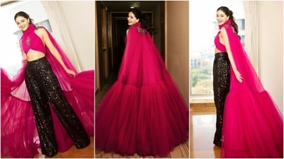 Ananya Panday posted pictures of her look for the Prime Video event on Instagram with the caption, "Hey Bae!" Rahul Mishra dressed the actor in a Barbie pink look styled with dazzling high-waisted pants. Celebrity stylist Ami Patel styled Ananya in the ensemble. It features a crop top, pants, and a tulle train attached to the back. (Instagram) Ananya Panday posted pictures of her look for the Prime Video event on Instagram with the caption, "Hey Bae!" Rahul Mishra dressed the actor in a Barbie pink look styled with dazzling high-waisted pants. Celebrity stylist Ami Patel styled Ananya in the ensemble. It features a crop top, pants, and a tulle train attached to the back. (Instagram)