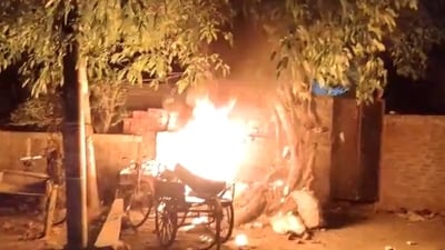 Angry locals set a shop on fire after the incident in Badaun's Baba Colony. Angry locals set a shop on fire after the incident in Badaun's Baba Colony.