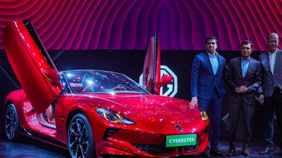 Mumbai: JSW Group Chairman Sajjan Jindal, JSW Cement Managing Director Parth Jindal and President and Managing Director of MG Motor India Rajeev Chaba unveil MG Cyberster electric sports car under SAIC Motor and JSW group's joint venture, in Mumbai, Wednesday, March 20, 2024. ( (PTI Photo/Shashank Parade)) Mumbai: JSW Group Chairman Sajjan Jindal, JSW Cement Managing Director Parth Jindal and President and Managing Director of MG Motor India Rajeev Chaba unveil MG Cyberster electric sports car under SAIC Motor and JSW group's joint venture, in Mumbai, Wednesday, March 20, 2024. ( (PTI Photo/Shashank Parade))