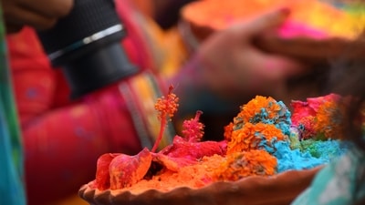 Manjal Kuli in Kerala: In Kerala, Holi is celebrated as Manjal Kuli, where people apply turmeric paste on each other as a symbol of purification and protection. This ritual signifies the cleansing of the body and soul. (Unsplash (Representative Photo)) Manjal Kuli in Kerala: In Kerala, Holi is celebrated as Manjal Kuli, where people apply turmeric paste on each other as a symbol of purification and protection. This ritual signifies the cleansing of the body and soul. (Unsplash (Representative Photo))