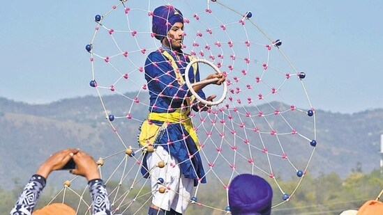 Hola Mohalla in Anandpur Sahib, Punjab: Hola Mohalla is a Sikh festival celebrated with martial arts demonstrations, mock battles, and processions showcasing valour and courage. It offers a unique blend of spirituality and martial traditions during Holi.&nbsp;(HT Photo/Sanjeev Sharma)