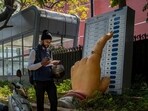 A man walks past a large model of a woman's finger pressing a button of an electronic voting machine displayed outside the office of Election Commission of India in New Delhi, India, Wednesday, March 20, 2024. From April 19 to June 1, nearly 970 million Indians - or over 10% of the world's population - will vote in the country's general elections. The mammoth electoral exercise is the biggest anywhere in the world - and will take 44 days to complete before results are announced on June 4. (AP Photo/Altaf Qadri)(AP)