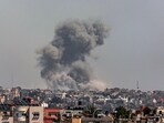 A picture taken from Rafah shows smoke billowing after Israeli bombardment on Khan Yunis in the southern Gaza Strip 