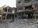 Palestinians search the rubble of a family home following Israeli bombardment west of the Nuseirat refugee camp in the central Gaza Strip. (AFP) Palestinians search the rubble of a family home following Israeli bombardment west of the Nuseirat refugee camp in the central Gaza Strip. (AFP)