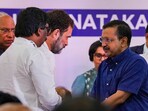 Congress leader Rahul Gandhi greets Delhi CM Arvind Kejriwal during a joint press conference in Bengaluru.