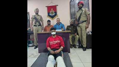 Gangster Movish Bains in the police custody on Thursday. (HT Photo)