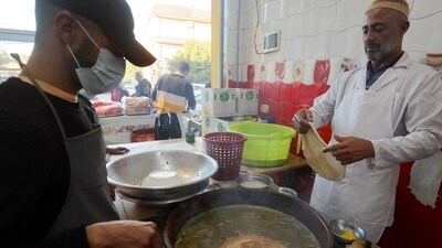 Once an affordable street food eaten on the go, sfinz has become a luxury for many Libyans amid the soaring cost of living. (AFP) Once an affordable street food eaten on the go, sfinz has become a luxury for many Libyans amid the soaring cost of living. (AFP)