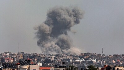 A picture taken from Rafah shows smoke billowing after Israeli bombardment on Khan Yunis in the southern Gaza Strip (AFP)