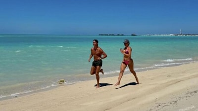 Cristiano Ronaldo and his partner Georgina Rodriguez go for a jog in the beach.