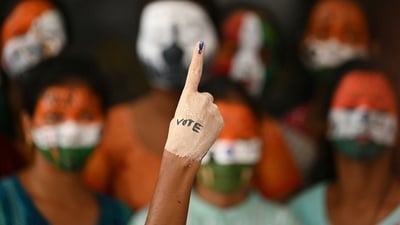 TOPSHOT - A college student has her face painted to spread awareness for first generation voters during an election campaign ahead of India's upcoming national elections in Chennai on March 19, 2024. (Photo by R. Satish BABU / AFP) (AFP)