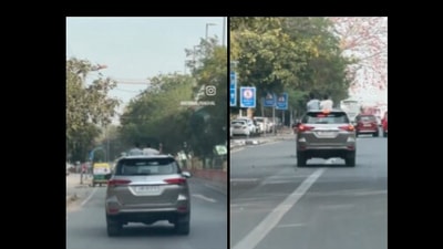 Snapshot of the two youths throwing water balloons from a moving car. (X/@SnehaSingh) Snapshot of the two youths throwing water balloons from a moving car. (X/@SnehaSingh)