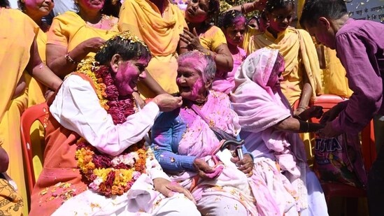 Resilience and Joy: Despite facing hardships and societal barriers, Vrindavan's widows exude resilience and joy during the Holi celebration, showcasing their unwavering spirit and determination to embrace life with positivity and courage.(HT File Photo)